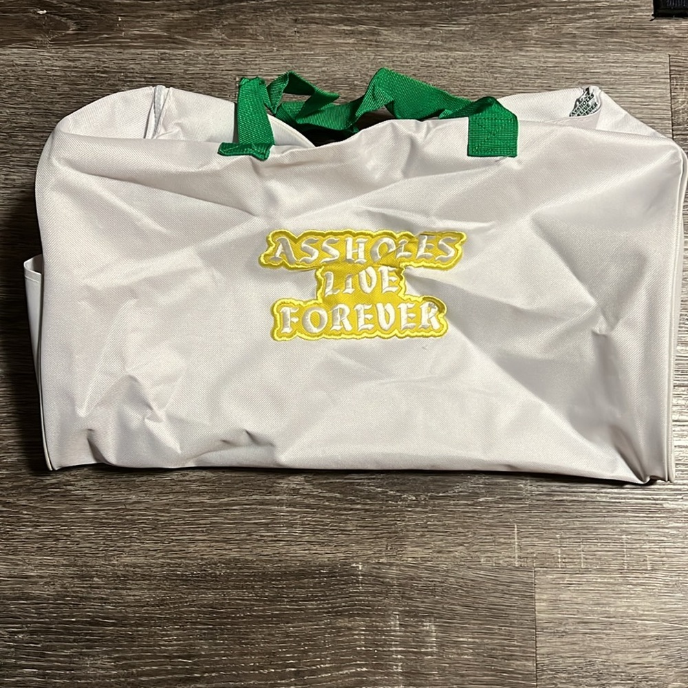 Brand New- EMOTIONAL BAGGAGE
WHITE YELLOW PRINTED STRAP LINED DUFFLE BAG